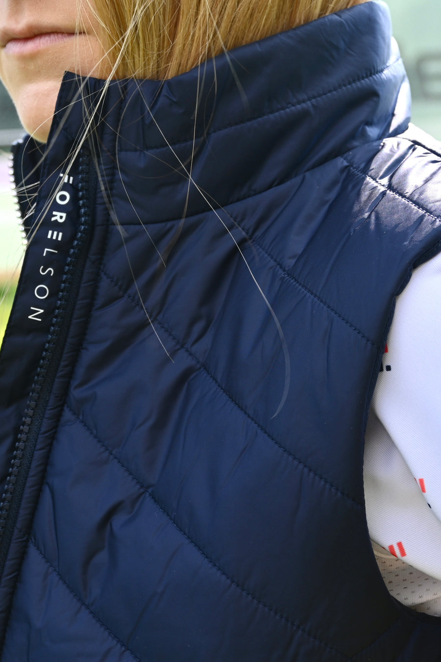 Women's navy golf gilet. Lightweight material, zip up with pockets. 