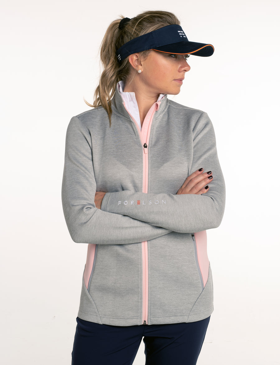 Women's grey and pink zip up golf jacket. Soft fabric that will stretch, allowing movement.