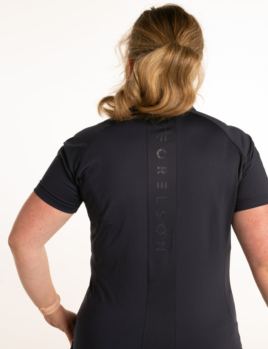 Women's navy golf polo shirt. Lightweight breathable fabric.